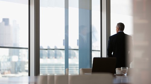 Man conference room window dawn raid